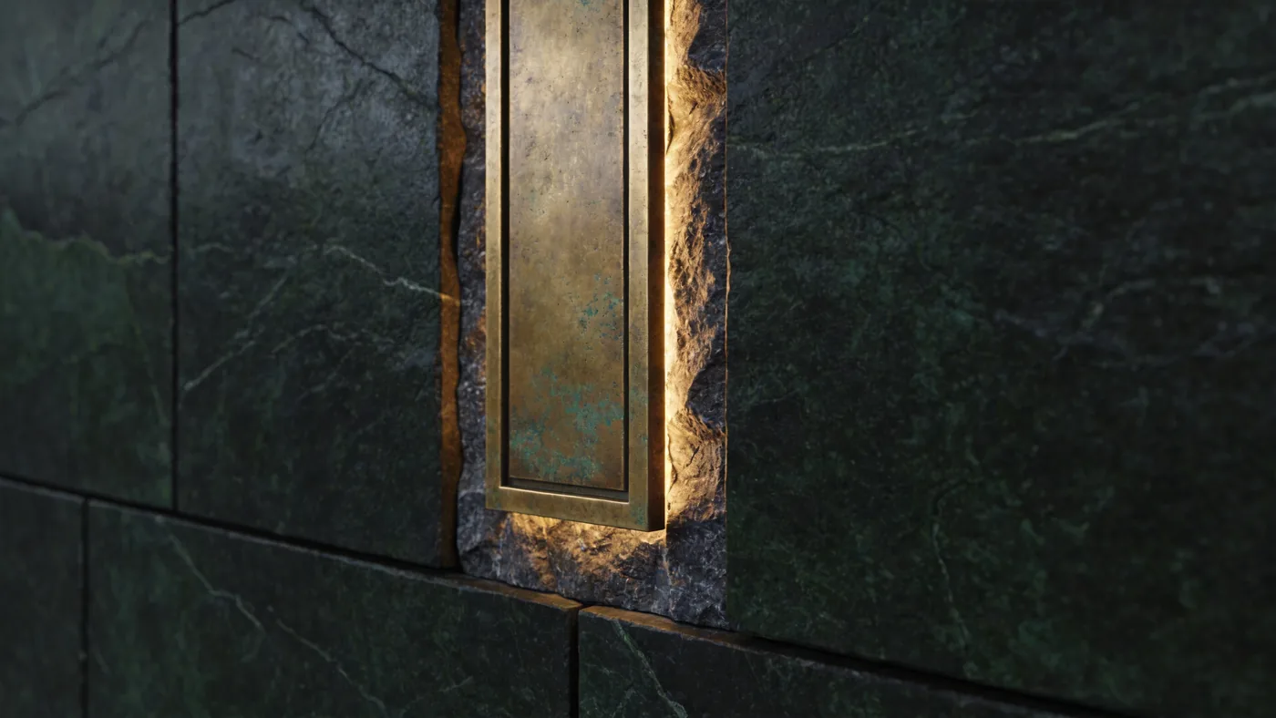 A line of aged brass in dark stone, catching the light.